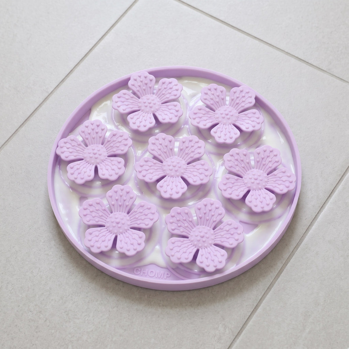 CHOMP Silicone Lick Mat with yoghurt on tiles